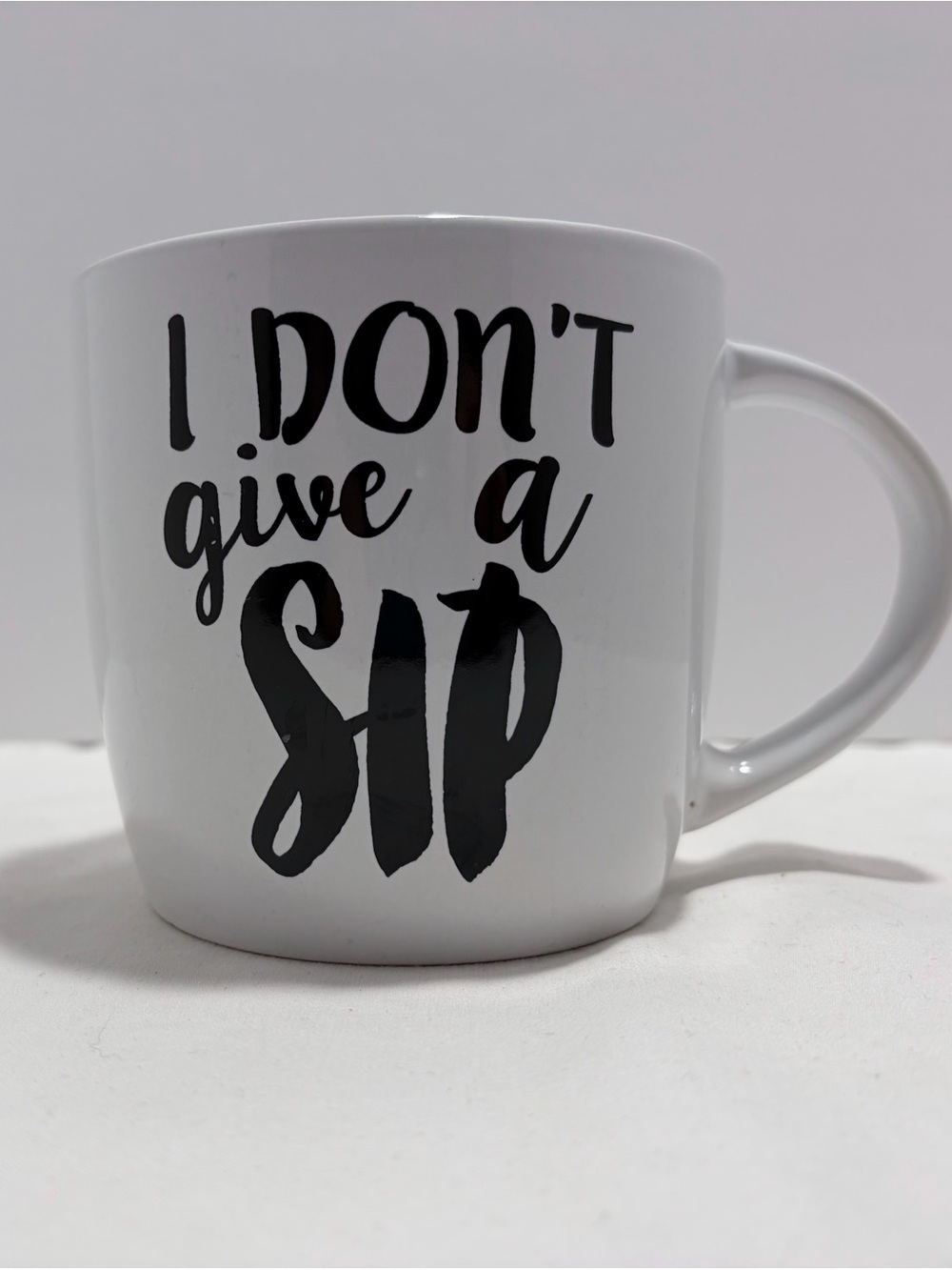 White and Black Ceramic Mug with 'I Don't Give a Sip' Text